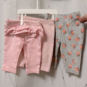 Newborn lot | 3 pair straight leg pants: floral print, ruffle bum, pink henley
